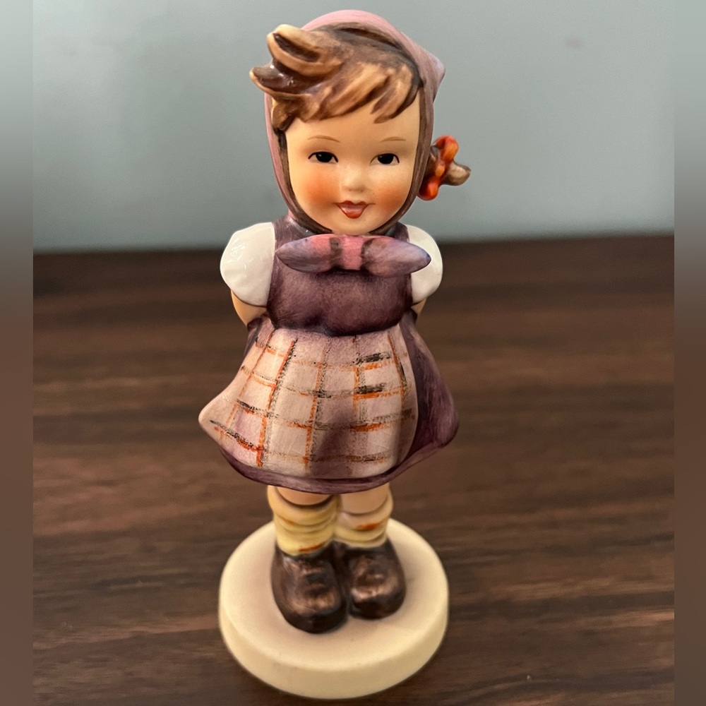 Charming Figurine with Purple and Brown Accents
